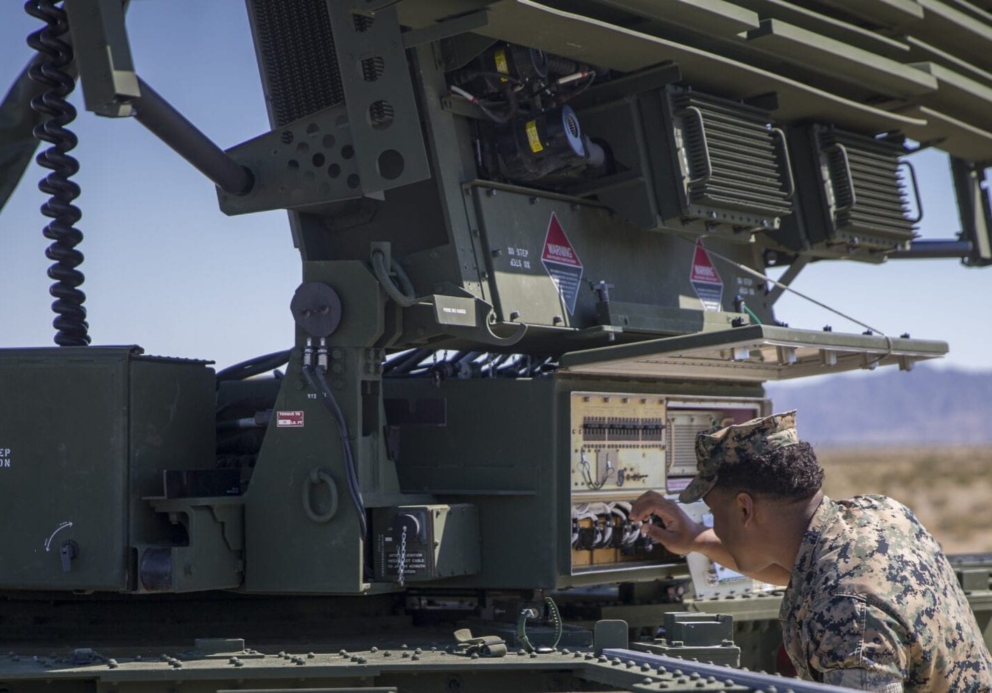 U.S. Marines with Marine Air Control Squadron 1, Marine Corps Air Station (MCAS) Yuma, conduct a routine check up on an AN/TPS-59 Radar on Cannon Air Defense Complex, MCAS Yuma April 5, 2020. The AN/TPS-59 Radar is a long-range transportable radar system used to detect and track threats to MAGTF operations. (U.S. Marine Corps Photo by Lance Cpl. John Hall)