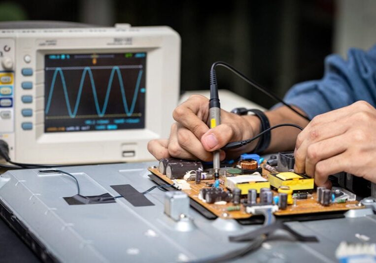 Electronic technician,banner, hands repairing electronic devices The use of modern one-stop service center concepts.