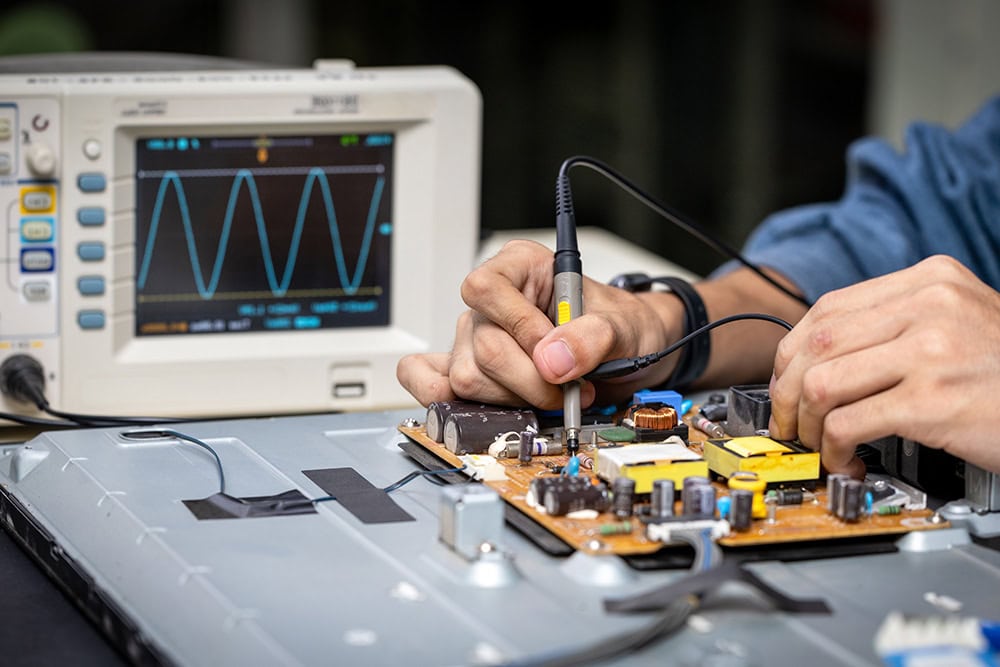 Electronic technician,banner, hands repairing electronic devices The use of modern one-stop service center concepts.